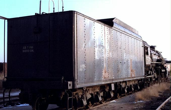 Image of an old, rusted railcar still on the railroad tracks. Railroad workers exposed to asbestos dust may be entitled to compensation.