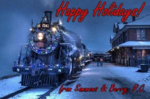 Image of a train at night in the snow, with the text "Happy Holidays! from Sammons & Berry, P.C." overlaid.